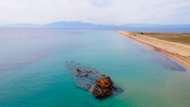Drone pics over a shipwreck next to a tropical beach in Epanomi, Macedonia, Greece