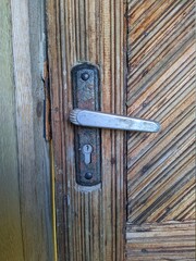 old handle of an old wooden door closeup photo