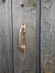 old handle of an old wooden door closeup photo