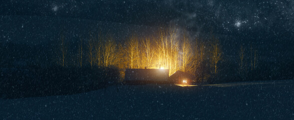 Beautiful night winter christmas landscape during snowfall. View of lonely snowy village houses lit by warm light from window. Starry night and a hunch of Christmas. Panoramic banner