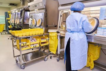 Black healthcare worker handling hazardous drugs for patient at hospital
