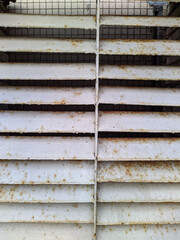 old and painted metal ventilation grilles close up photo
