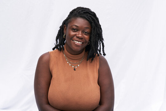 Portrait Smiling Plus Size Black Woman With Locs