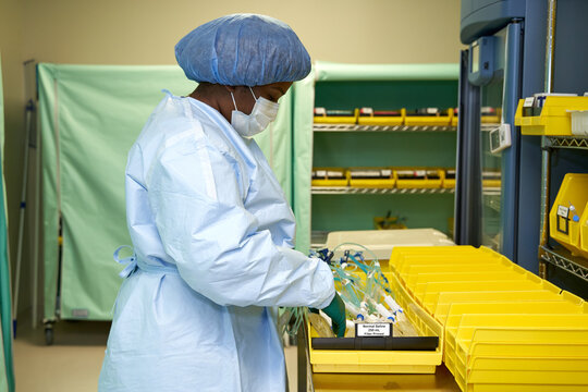 Black healthcare worker pharmacist handling hazardous drugs for patient at hospital