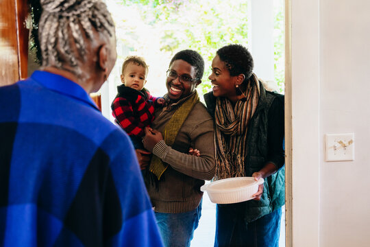 Black Family Visiting Grandmother For Christmas Holidays