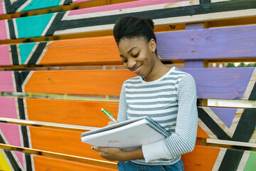 Young Black teen female studying art at school