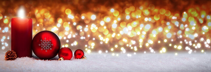Christmas background with Advent candle and red decoration.