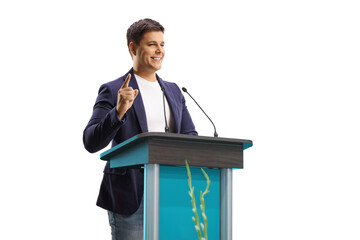 Man speaker with a hands free microphone on a pedestal gesturing with finge
