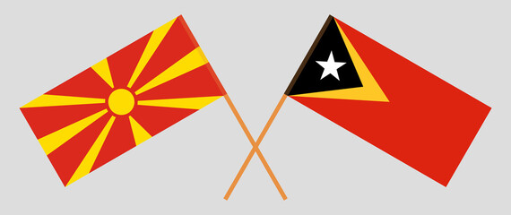 Crossed flags of East Timor and North Macedonia