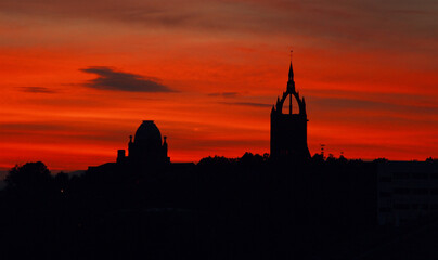 silhouette of paisley with red sky at night