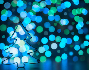 Christmas tree toy for home decoration on the background of Christmas lights. defocus christmas blue lights