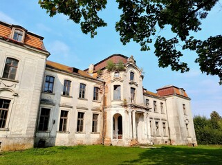 ZHELUDOK, BELARUS - SEPTEMBER 12, 2020: The abandoned manor of Svyatopolk-Chetvertinsky, built in the early 20th century. Popular tourist attraction in Belarus - 385609574