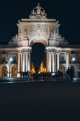 Lisboa, Portugal 9.10.2020 Rue Augusta arch in Commerce square at night at Praca do Comercio. sculptures of Viriatus, Vasco da Gama, Pombal, Nuno Alvares Pereira on praca do Comercio. Vertical size