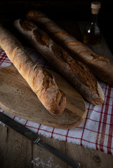 Fresh bread on a wooden table in rustic style