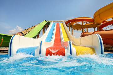 Colorful slides in water park. Summer vacation