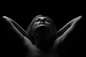 Black and white glamor woman portrait, dark beautiful face, female isolated on black background, stylish sexy look, young lady studio shot