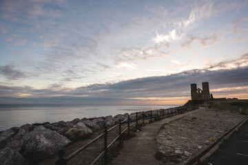 Remains of Reculver church towers at early october sunrise  early october sunrise