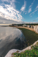 Empty Kingsgate Beach and Castle on the cliffs above the Bay, on cloudy autumn morning.