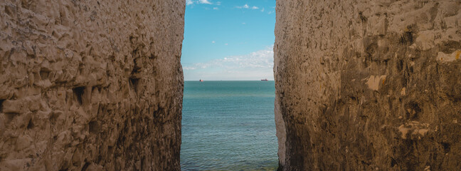 Empty Kingsgate Beach, walking through the chalk stacks clifs at Botany Bay in Kent, England.