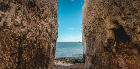 Empty Kingsgate Beach, walking through the chalk stacks clifs at Botany Bay in Kent, England.