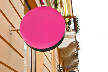 Round sign on the building. Copy space and space for text. Mockup for design. Blank template for advertising.