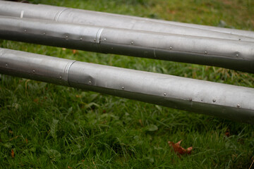 Hot water pipes. Street communications. Steel pipes above the ground.