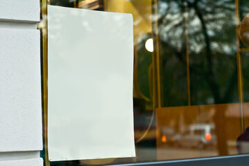Banner for advertising in a shop window. Sign Board behind the glass. Copy space and space for...