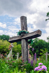An old wooden cross at an old cemetery in Kopychyntsi, Ukraine