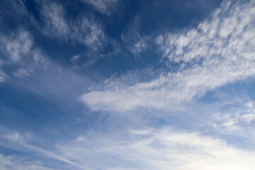 Stunning cirrus cloud formation panorama in a deep blue sky
