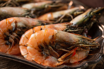 Close-up view of coked tiger shrimps on the metal dish. Macro photo. Seafood concept. Delicious meal. Traditional Thai food.