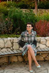 Portrait of cheerful beautiful woman with short hair in glasses.