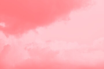 Abstract pastel pink coral color sky background with clouds