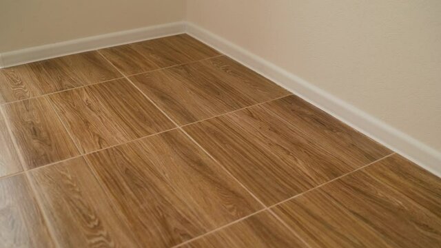 The tiles are in wood color. Wood tile texture background