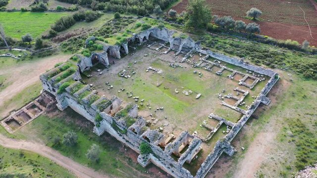 Evdirhan inn: Historical and ancient ruins, accommodation of camel caravans. Termessos ancient city is very close to the region. Circular aerial view. Evdirh, the Seljuk era Antalya / TURKEY. 4K Video