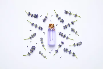 Foto op Canvas Composition with lavender flowers and natural essential oil on white background, top view © New Africa