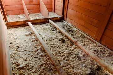 Interior of a dirty empty chicken coop. © Road Red Runner