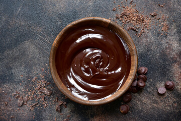 Homemade chocolate ganache in a wooden bowl . Top view with copy space.