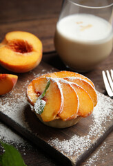 Delicious peach dessert served on wooden table