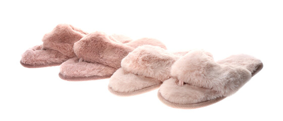 Different stylish soft slippers on white background