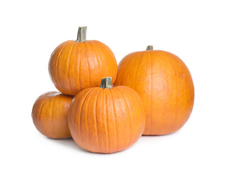 Beautiful ripe orange pumpkins on white background