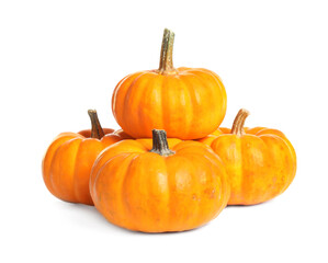 Beautiful ripe orange pumpkins on white background