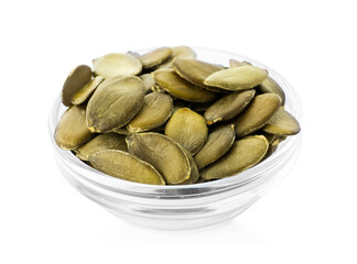 Peeled pumpkin seeds in glass bowl isolated on white