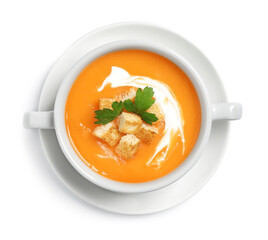 Delicious pumpkin soup in bowl isolated on white, top view