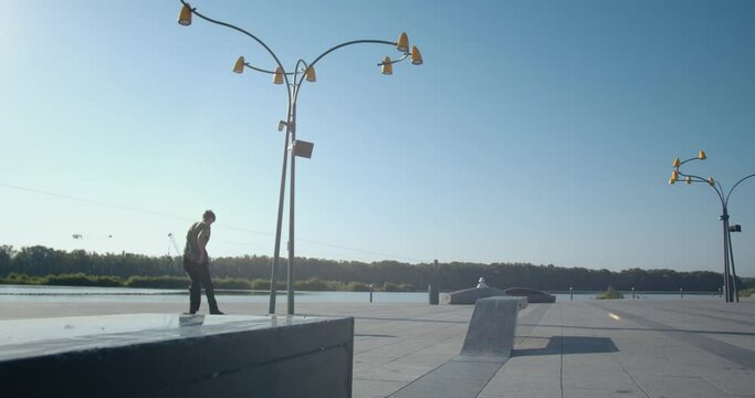 Stunning kickflip performed by a skater boy at the park, 4k