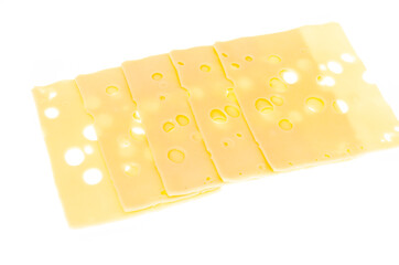 Slices of cheese with holes isolated on white background