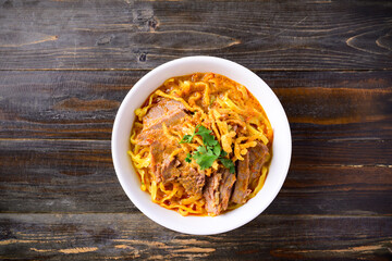 Northern Thai food (Khao Soi), Spicy curry noodles soup with beef in a bowl