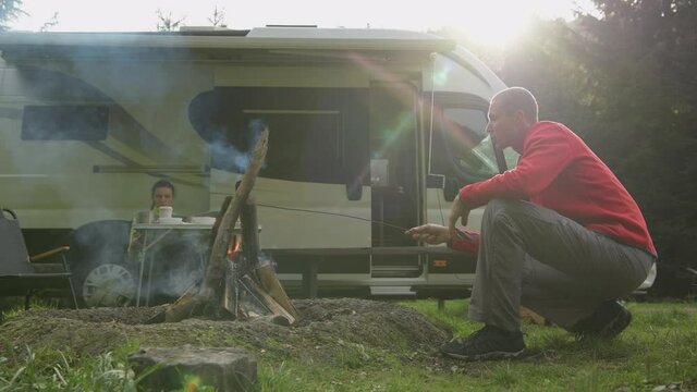 RV Park Campfire and Couple Hanging Together 