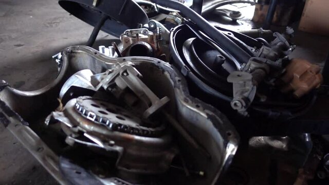 Dolly Shot Of Parts in The Engine Compartment Of A Car.