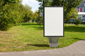 Advertising billboard stand mock up in the public city park.