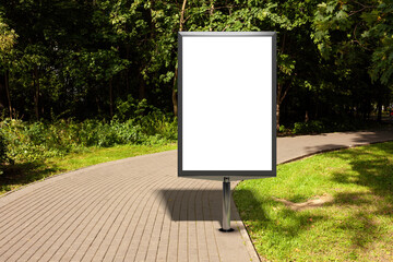 Advertising billboard stand mock up in the public city park.